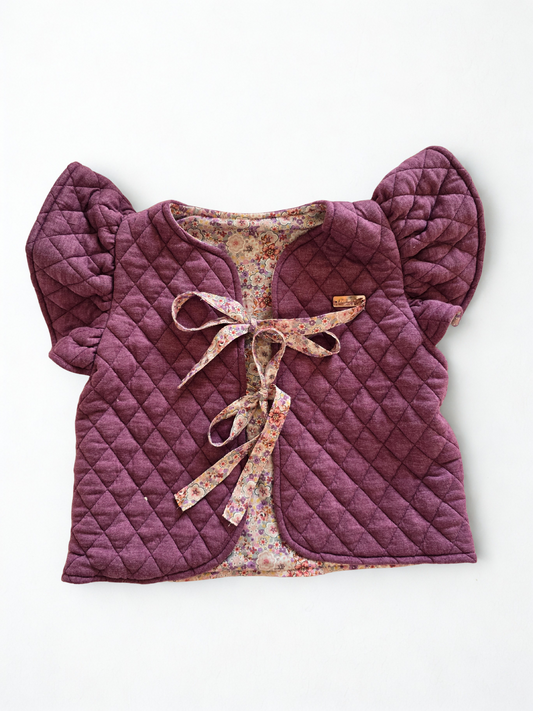 Vaikiška liemenė su gėlėtu pamušalu