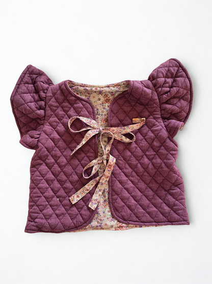 Vaikiška liemenė su gėlėtu pamušalu