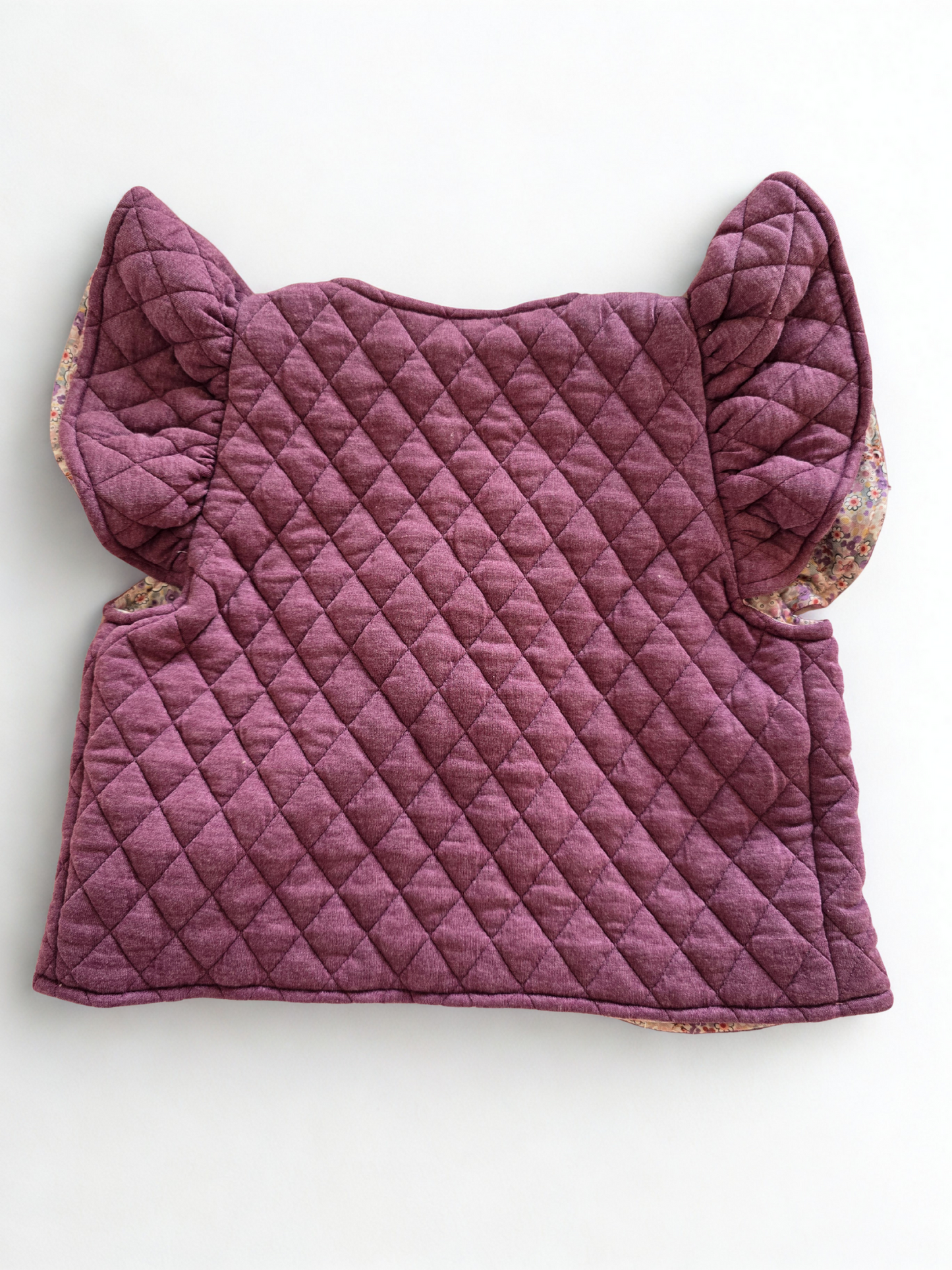 Vaikiška liemenė su gėlėtu pamušalu